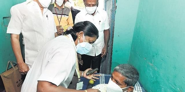 File photo of CM MK Stalin watches as a beneficiary of the Makkalai Thedi Maruthuvam scheme receives treatment at home in Samanapalli village, Krishnagiri on Thursday